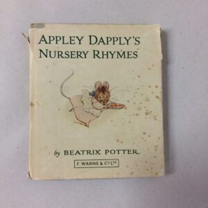 An old copy of a book called Appley Dapply's Nursery Rhymes by Beatrix Potter, with a white cover
