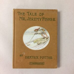 An old copy of a book called The Tale of Mr. Jeremy Fisher by Beatrix Potter, with a brown cover