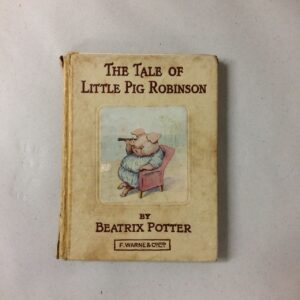 An old copy of a book called The Tale of Little Pig Robinson by Beatrix Potter