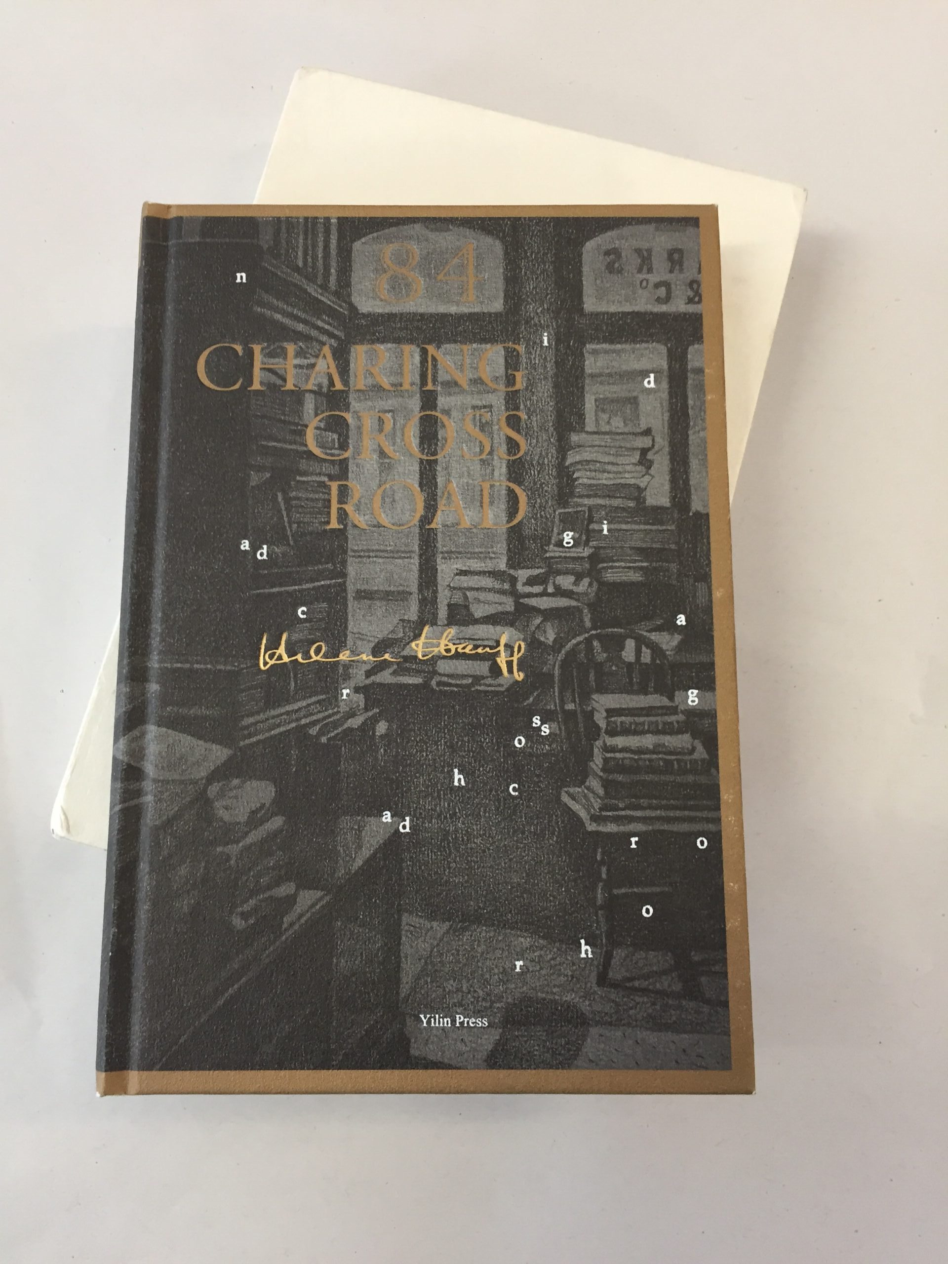84 Charing Cross Road by Helene Hanff, featuring a dark brown and gold illustrated cover published by Yilin Press
