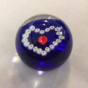 vintage Caithness Scotland Miniature Heart paperweight in cobalt blue glass featuring a central red heart framed by a millefiori garland
