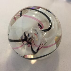 vintage Caithness Ribbons art glass paperweight from Scotland, featuring pink, white, and black swirls encased in clear glass
