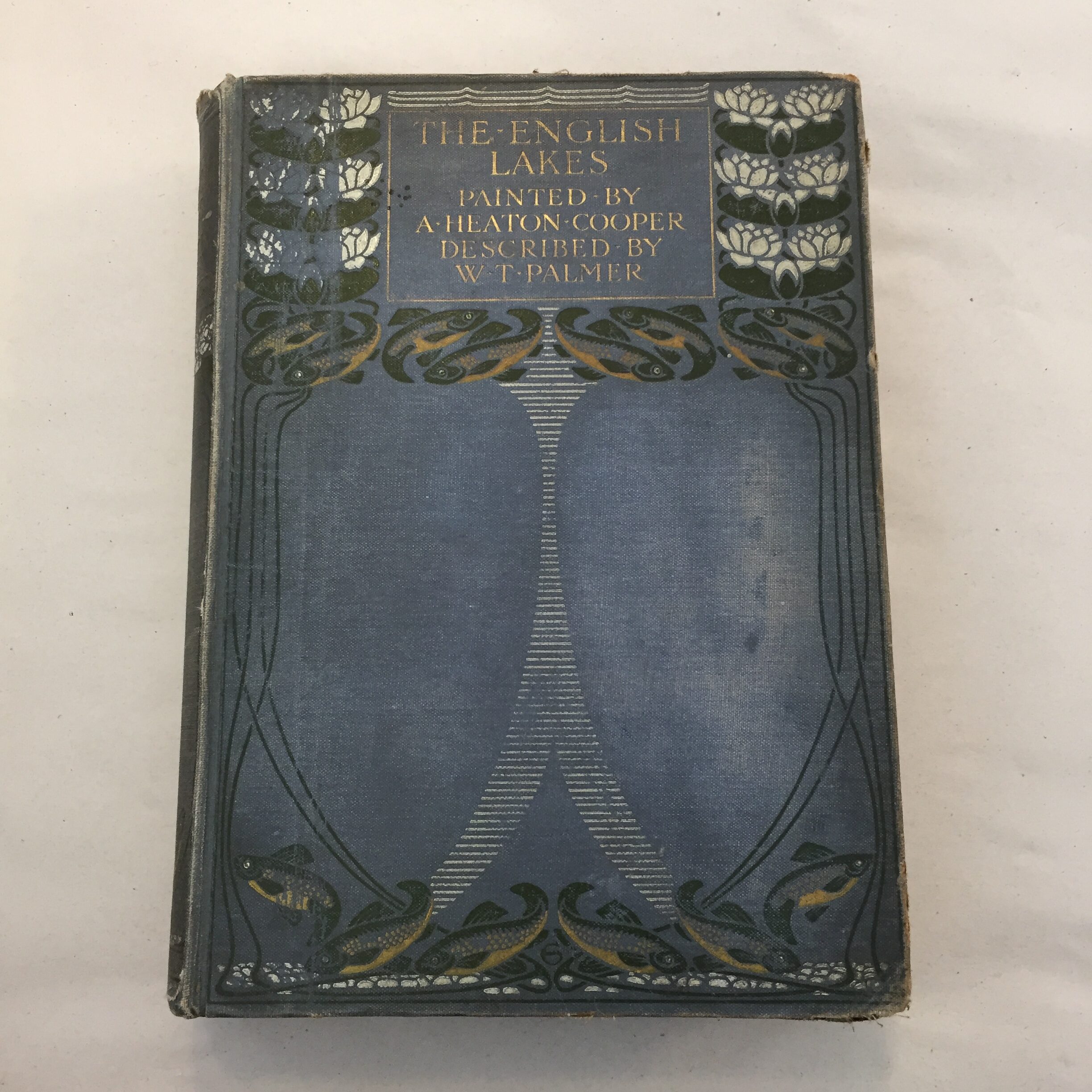 The English Lakes, painted by A. Heaton Cooper and described by W.T. Palmer, featuring a distinctive blue Art Nouveau pictorial cloth cover 1905