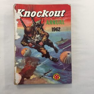 Knockout Annual 1962, published by Amalgamated Press featuring a dynamic painted cover of a paratrooper descending amidst an aerial and naval battle